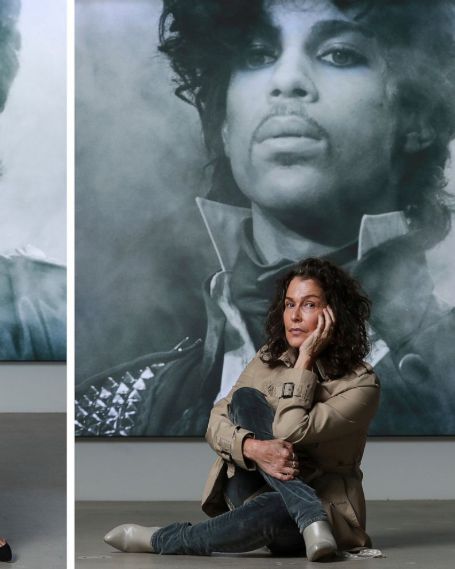 Susannah sitting infront of prince's picture 